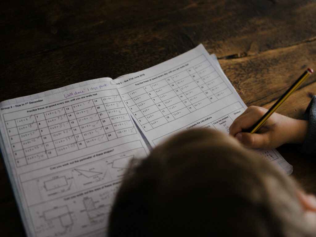 A child working through a lesson at a desk