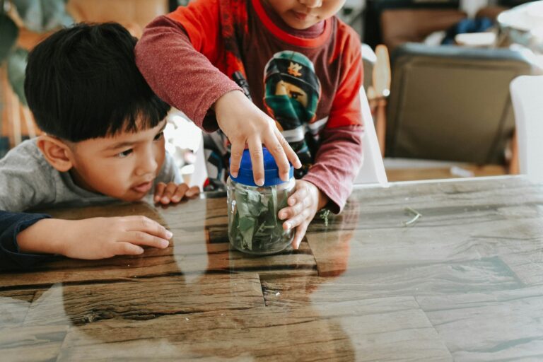 Two children with a jar of coins
